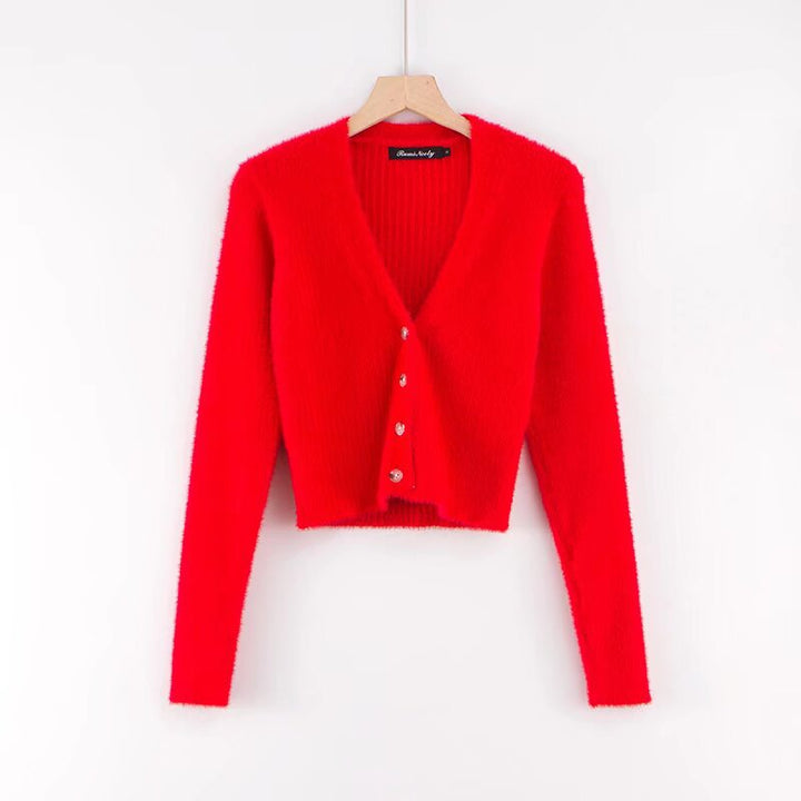 Damer cropped stickad jacka med dekorativa knapppdetaljer Mirla-Eva Jonsson