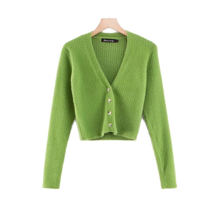 Damer cropped stickad jacka med dekorativa knapppdetaljer Mirla-Eva Jonsson