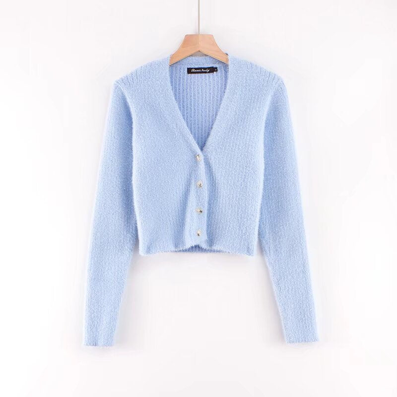 Damer cropped stickad jacka med dekorativa knapppdetaljer Mirla-Eva Jonsson