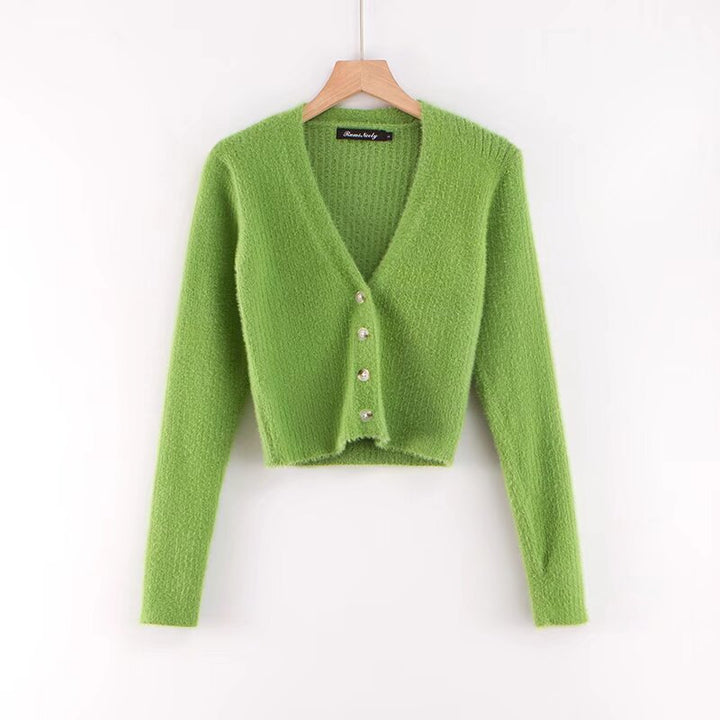 Damer cropped stickad jacka med dekorativa knapppdetaljer Mirla-Eva Jonsson