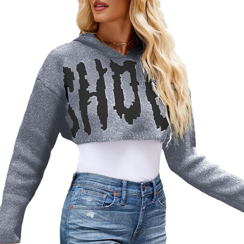 Damer cropped stickad tröja med iögonfallande text Mirla-Eva Jonsson