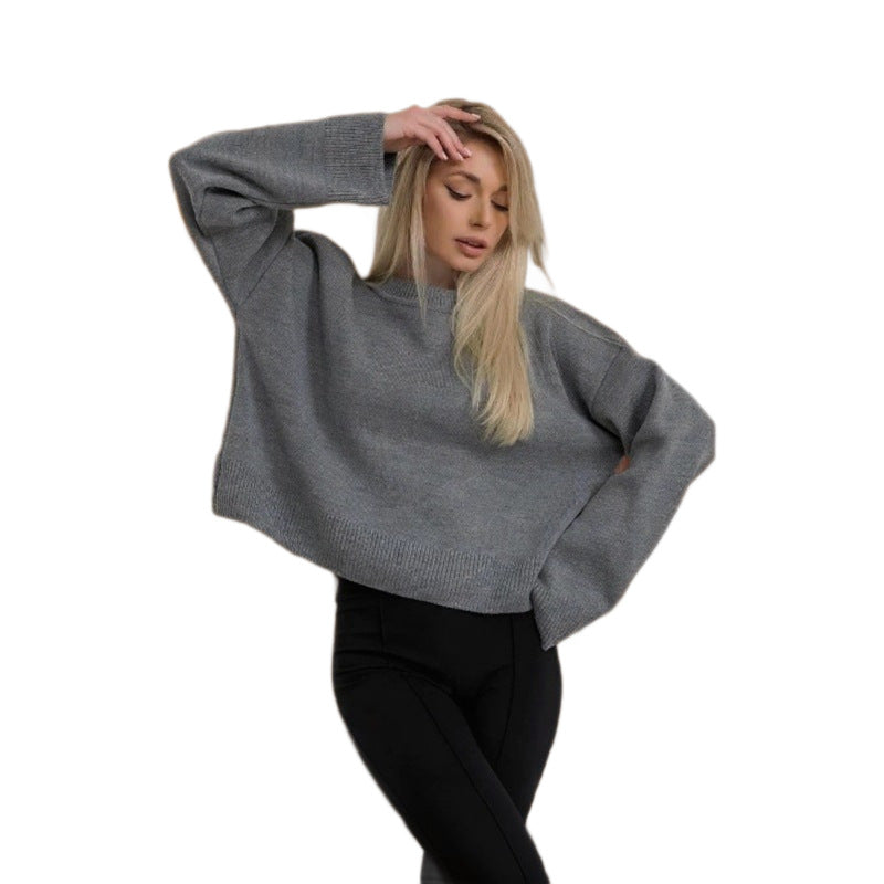 Damer cropped stickad tröja med voluminösa ärmar och rundhalsringning Mirla-Eva Jonsson