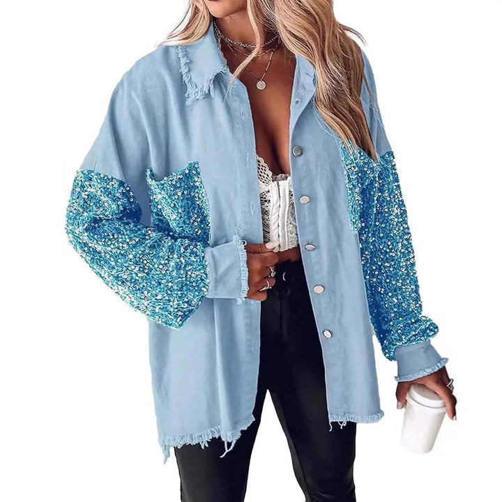 Damer denimblus med glittrande ärmar och fransig nederkant Mirla-Eva Jonsson