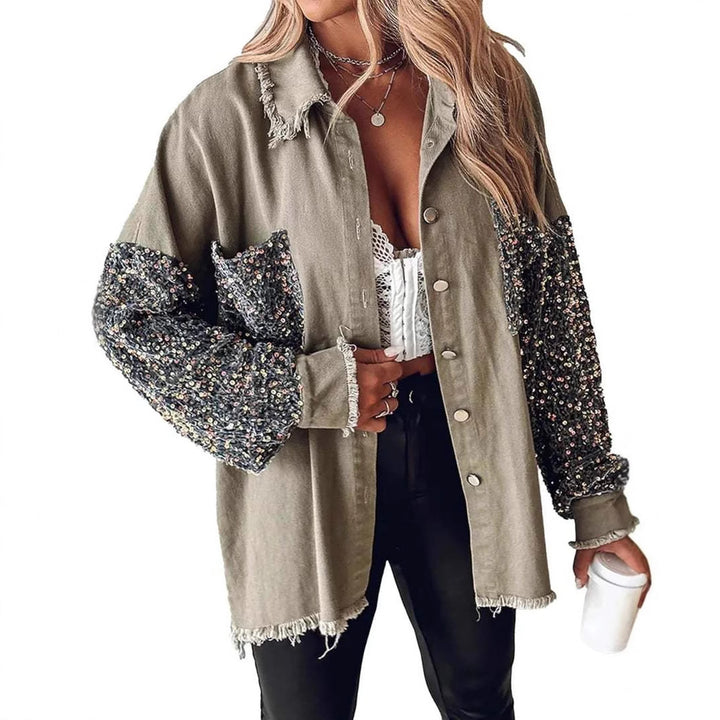 Damer denimblus med glittrande ärmar och fransig nederkant Mirla-Eva Jonsson