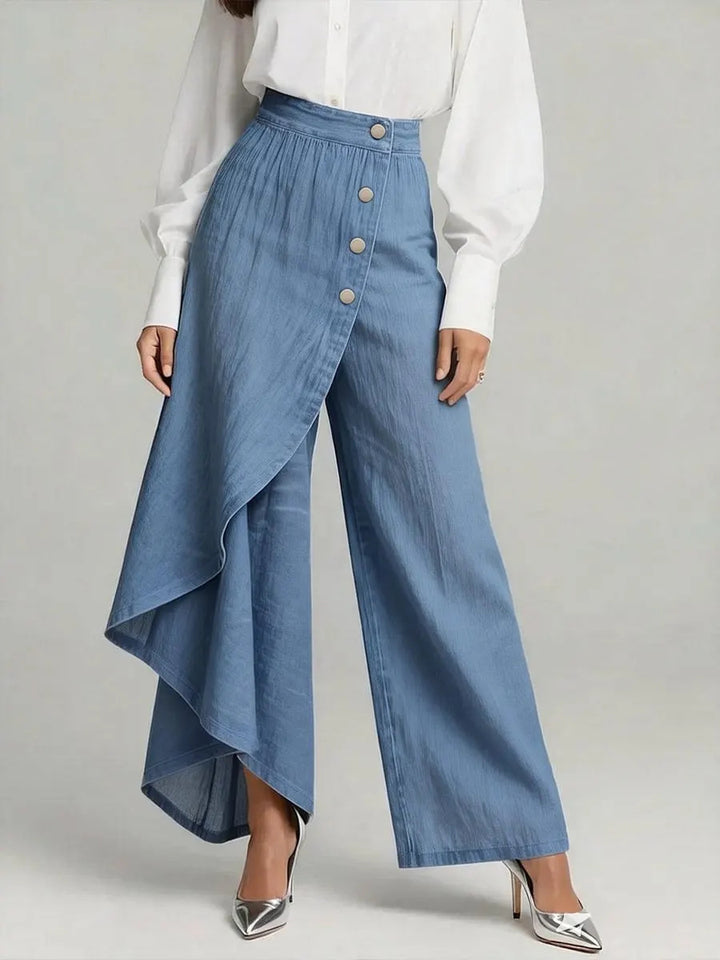 Damer denimkjol med asymmetrisk snitt och knappdetaljer Mirla-Eva Jonsson