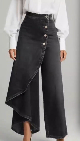 Damer denimkjol med asymmetrisk snitt och knappdetaljer Mirla-Eva Jonsson