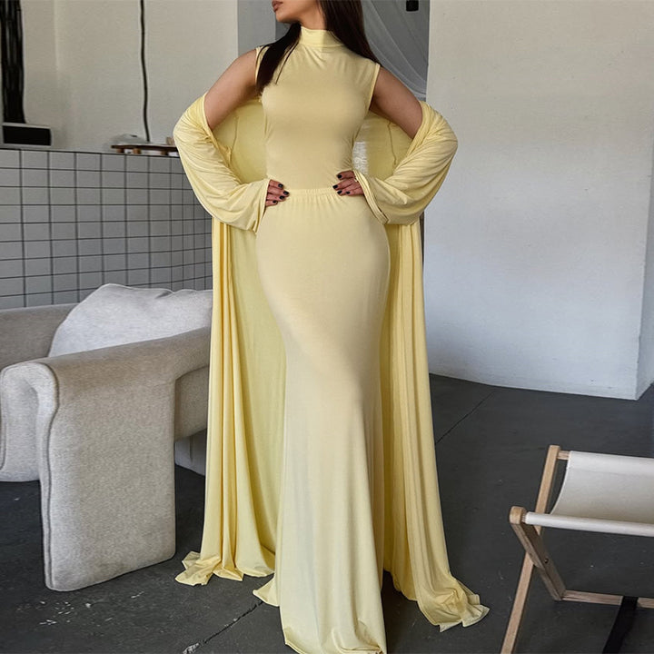 Damer elegant Maxi klänning med vid cape och långa ärmar Mirla-Eva Jonsson