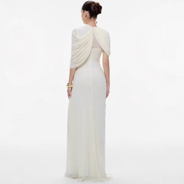 Damer elegant Maxiklänning med innovativa draperingsdetaljer och asymmetrisk överdel Mirla-Eva Jonsson