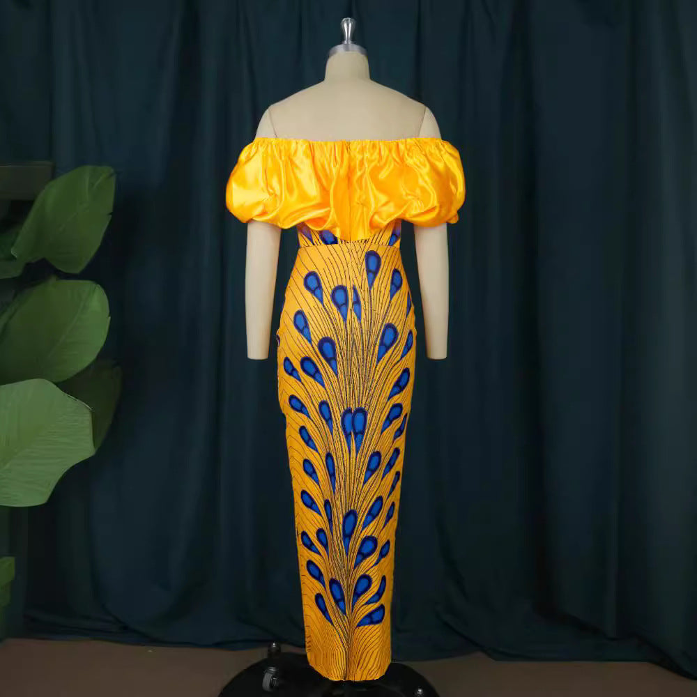 Damer elegant aftenkjole med skulderfri design og voluminøst flæsekant Mirla-Eva Jonsson
