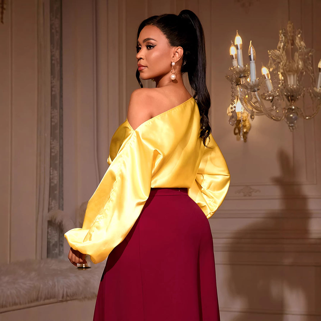 Damer elegant asymmetrisk topp med voluminösa puffärmar Mirla-Eva Jonsson