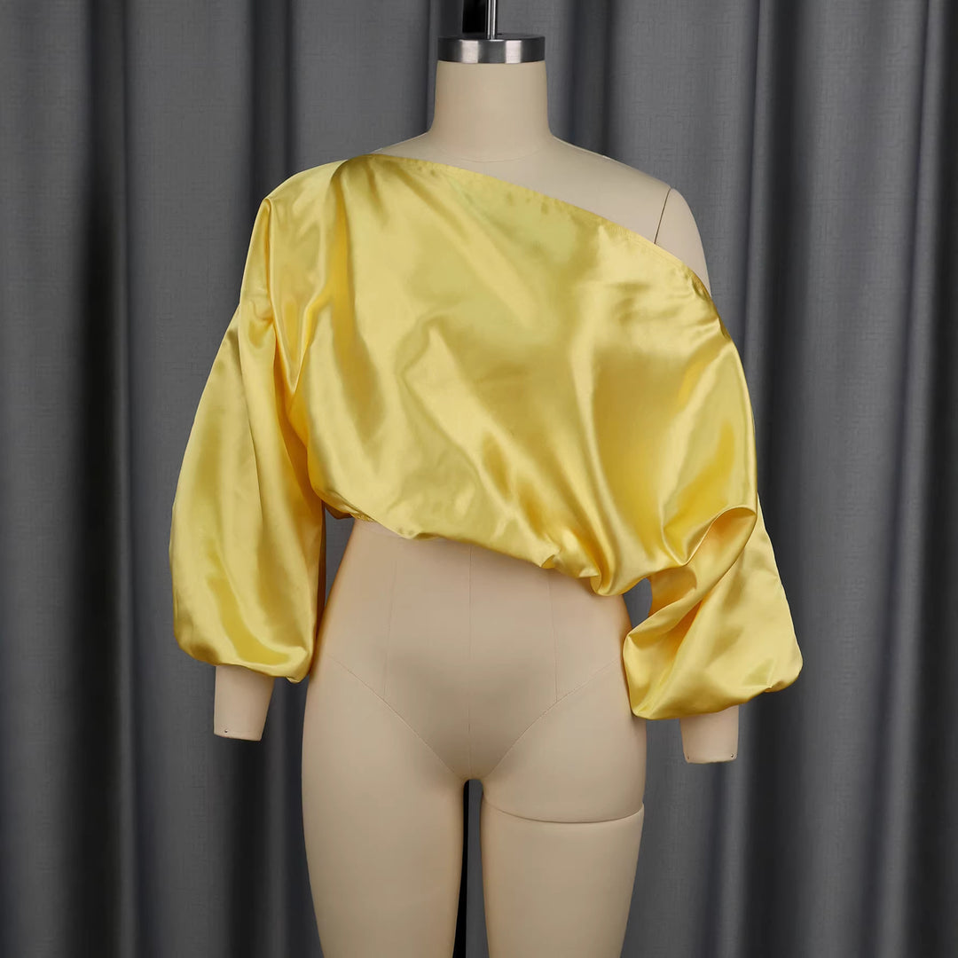 Damer elegant asymmetrisk topp med voluminösa puffärmar Mirla-Eva Jonsson