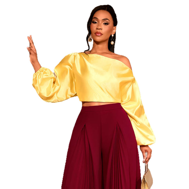Damer elegant asymmetrisk topp med voluminösa puffärmar Mirla-Eva Jonsson