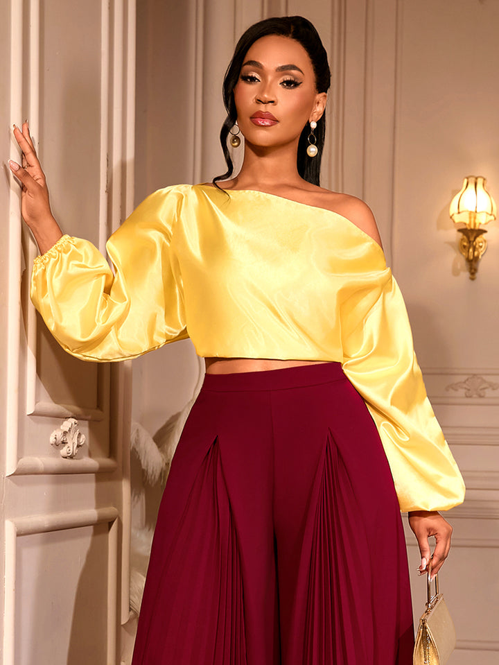 Damer elegant asymmetrisk topp med voluminösa puffärmar Mirla-Eva Jonsson