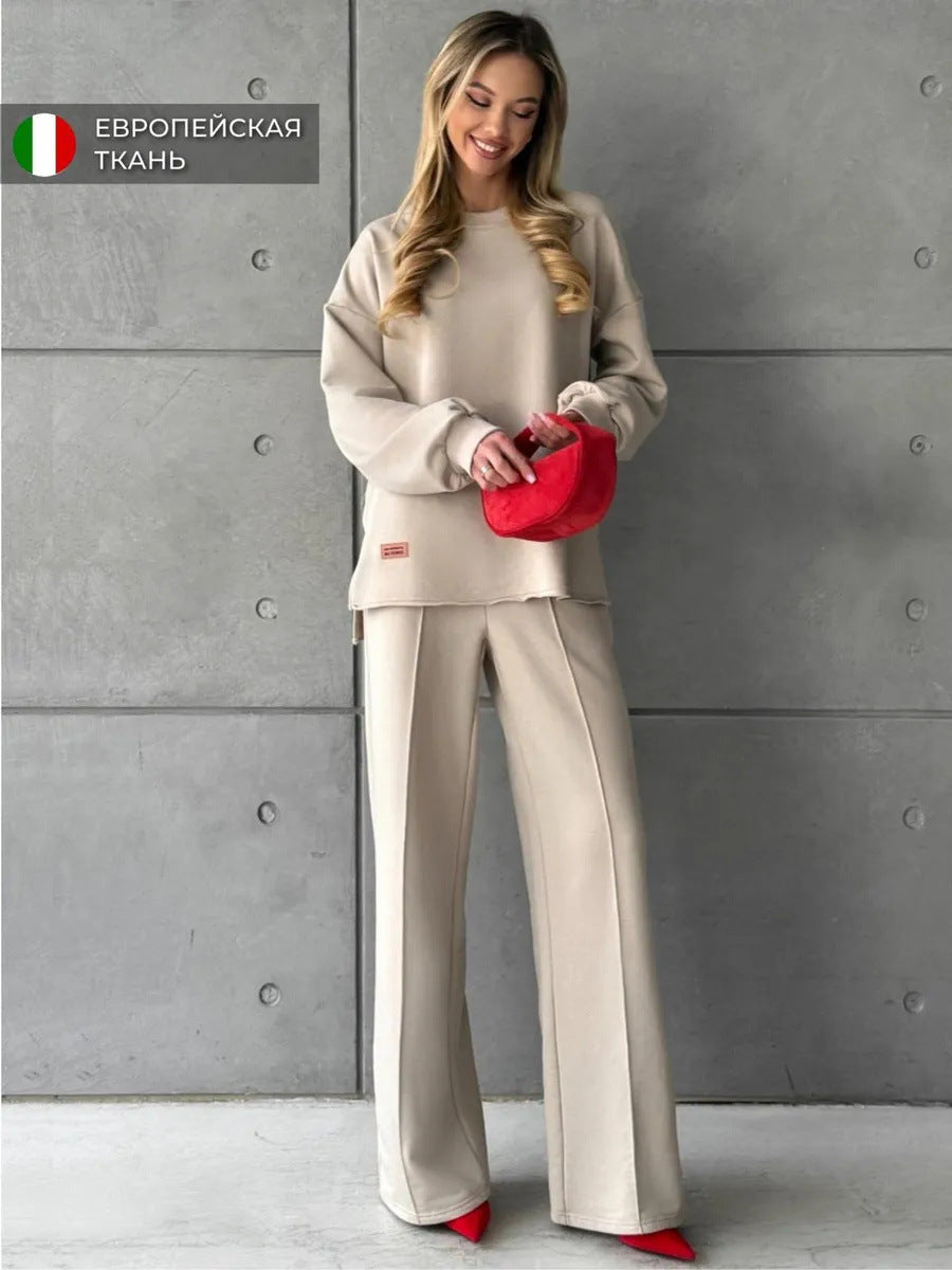 Damer elegant, avslappnad tvådelad outfit med vida byxor och oversized sweatshirt Mirla-Eva Jonsson
