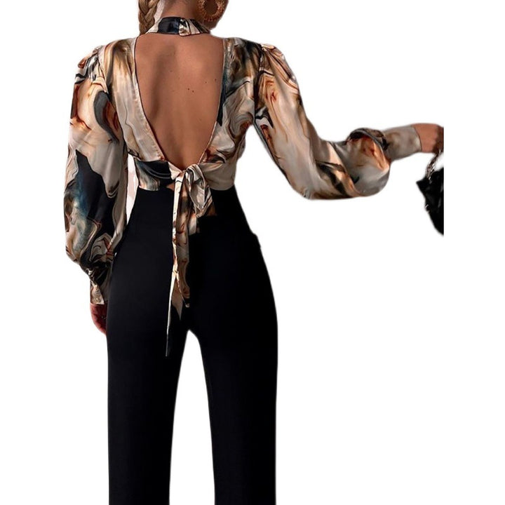 Damer elegant blus med en raffinerad nyckelhålsringning och voluminösa ärmar Mirla-Eva Jonsson