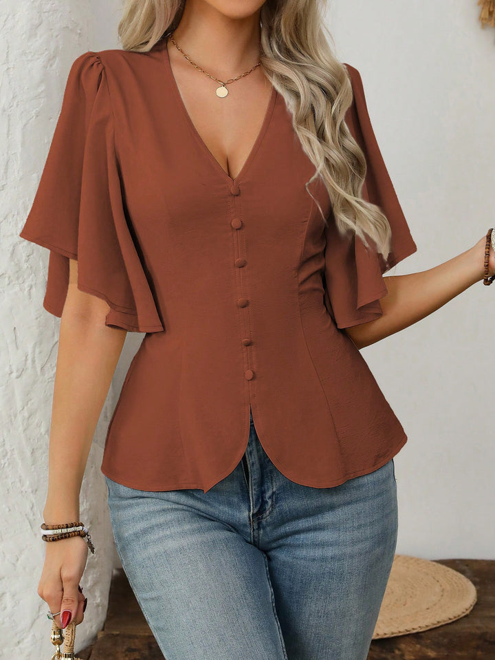 Damer elegant blus med klockärmar och knapppdetail Mirla-Eva Jonsson