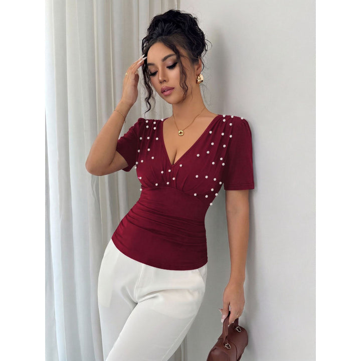 Damer elegant blus med pärldetalj Mirla-Eva Jonsson