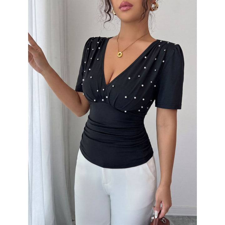 Damer elegant blus med pärldetalj Mirla-Eva Jonsson