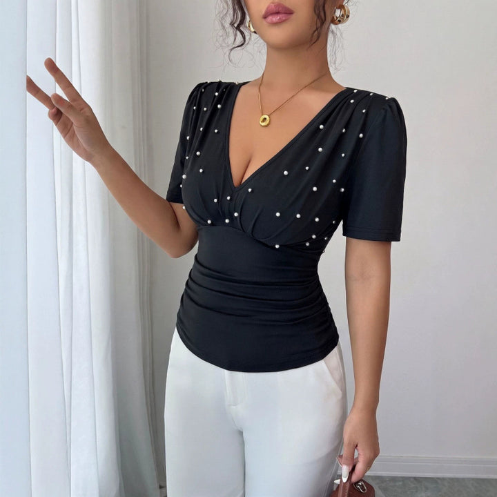 Damer elegant blus med pärldetalj Mirla-Eva Jonsson