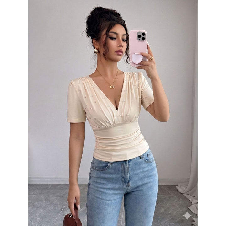 Damer elegant blus med pärldetalj Mirla-Eva Jonsson