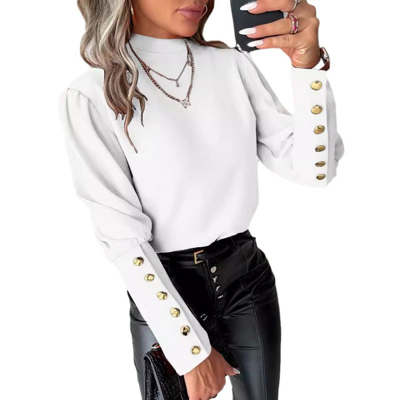 Damer elegant blus med puffärmar och gyllene knappdetaljer Mirla-Eva Jonsson