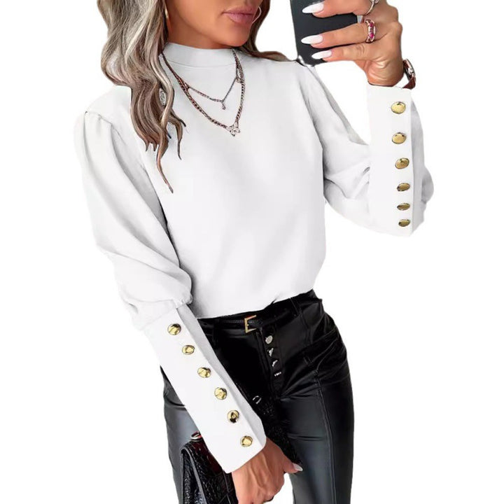 Damer elegant blus med puffärmar och gyllene knappdetaljer Mirla-Eva Jonsson