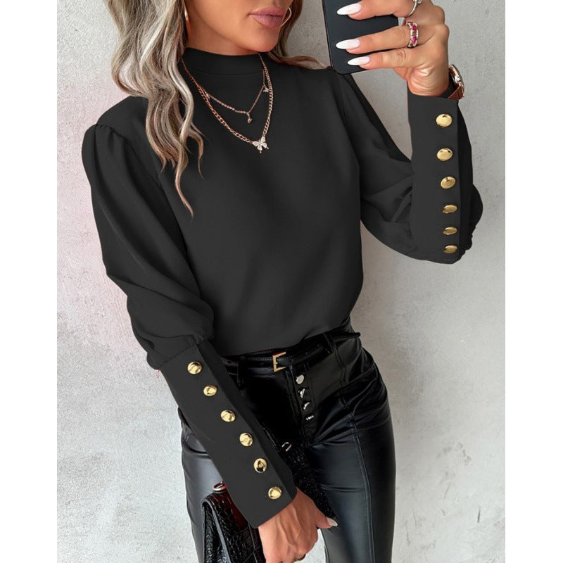 Damer elegant blus med puffärmar och gyllene knappdetaljer Mirla-Eva Jonsson