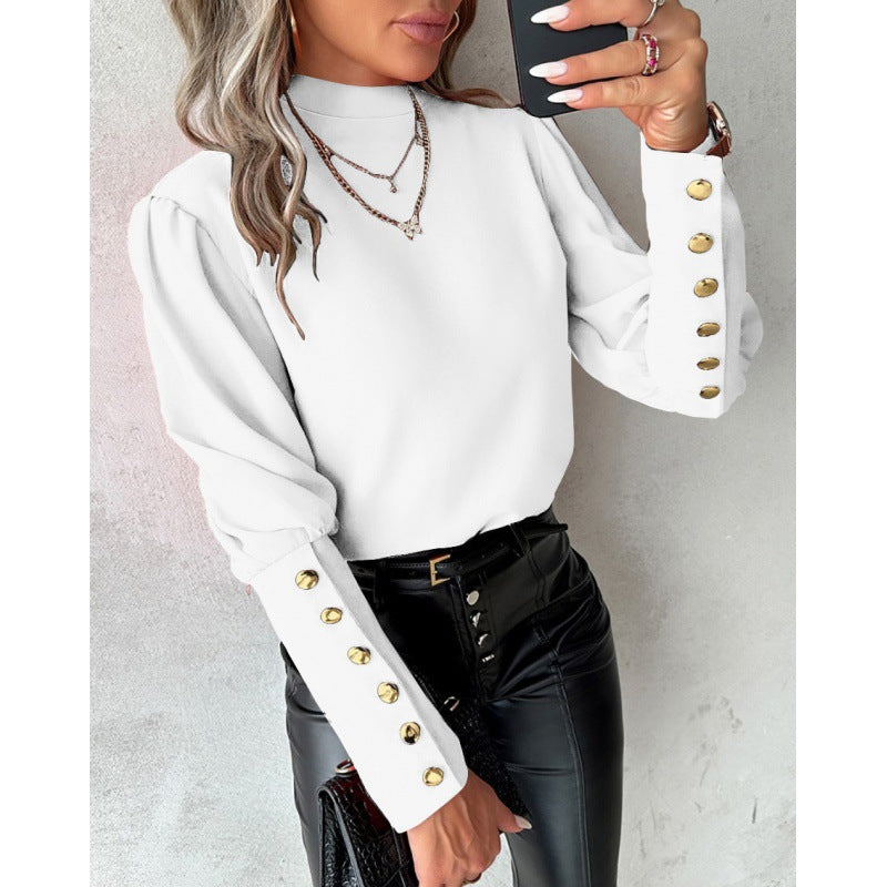 Damer elegant blus med puffärmar och gyllene knappdetaljer Mirla-Eva Jonsson