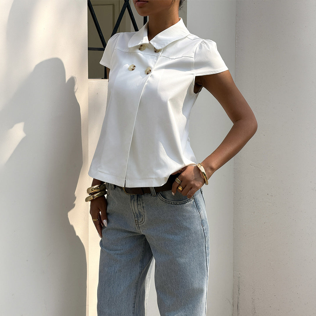 Damer elegant blus med stiliga knappdetaljer och krage Mirla-Eva Jonsson