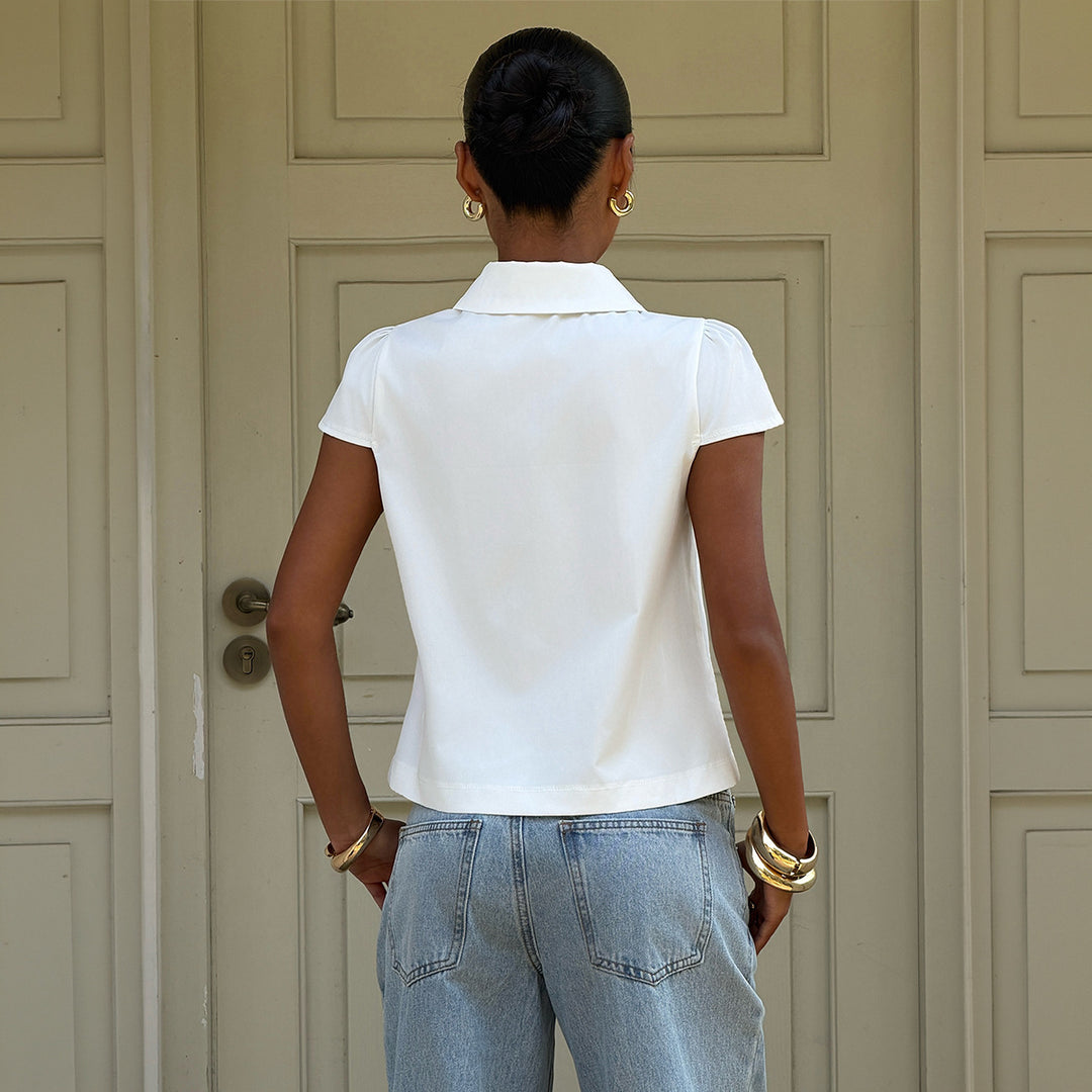 Damer elegant blus med stiliga knappdetaljer och krage Mirla-Eva Jonsson
