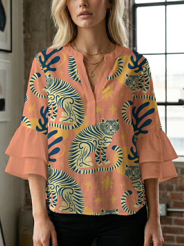 Damer elegant blusenshirt med voluminösa ryschärmar och grafisk blommönster Mirla-Eva Jonsson
