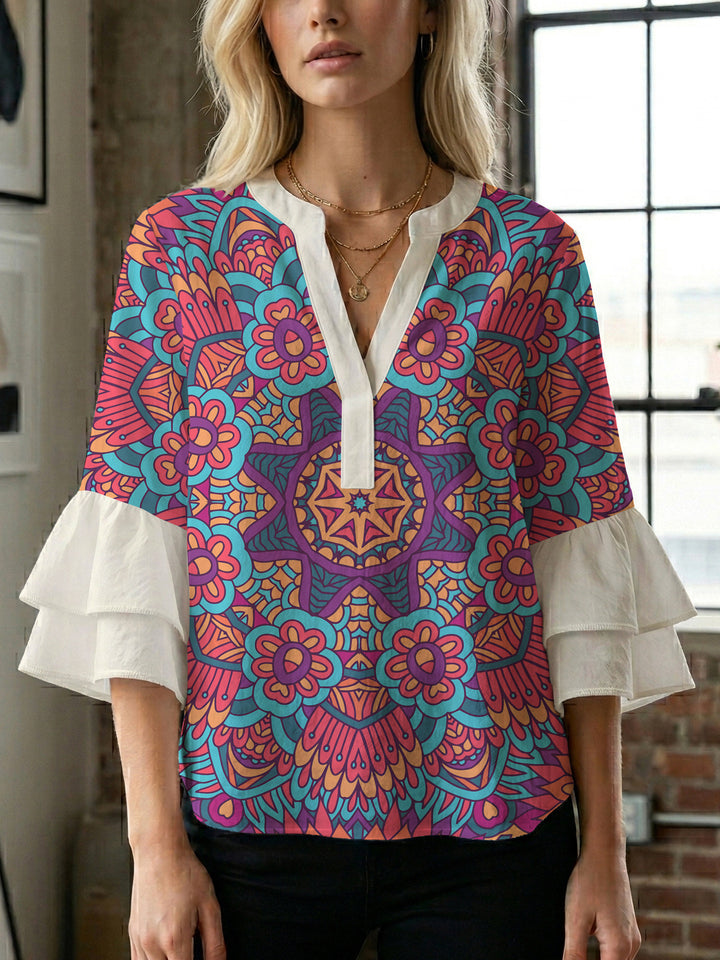 Damer elegant blusenshirt med voluminösa ryschärmar och grafisk blommönster Mirla-Eva Jonsson