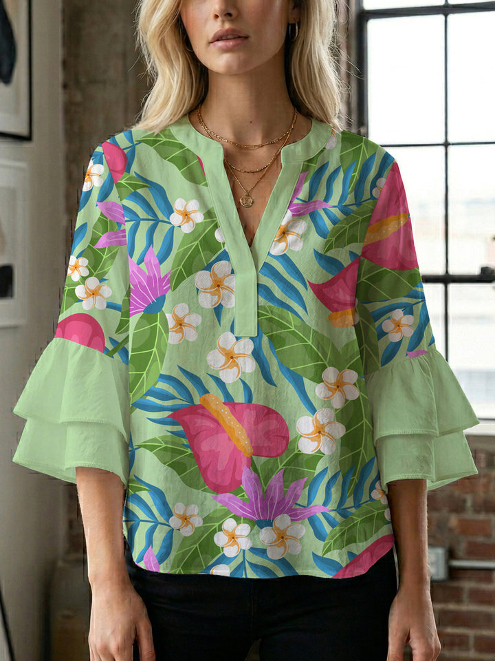 Damer elegant blusenshirt med voluminösa ryschärmar och grafisk blommönster Mirla-Eva Jonsson
