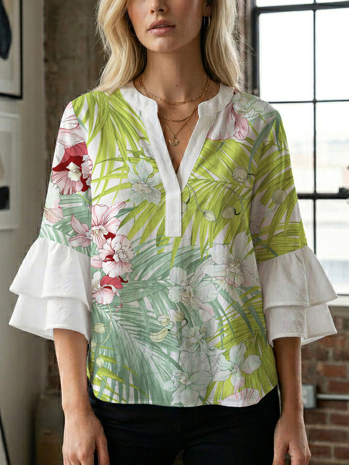 Damer elegant blusenshirt med voluminösa ryschärmar och grafisk blommönster Mirla-Eva Jonsson