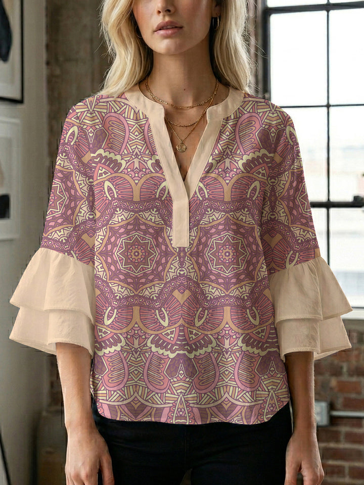Damer elegant blusenshirt med voluminösa ryschärmar och grafisk blommönster Mirla-Eva Jonsson