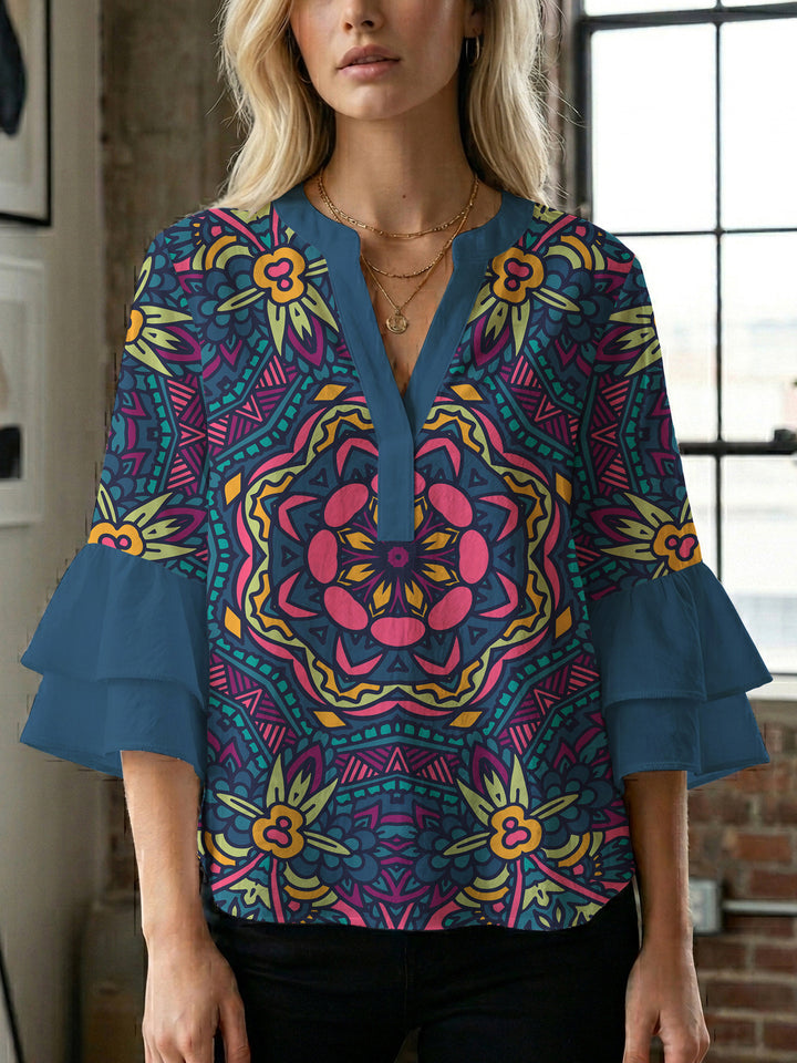 Damer elegant blusenshirt med voluminösa ryschärmar och grafisk blommönster Mirla-Eva Jonsson