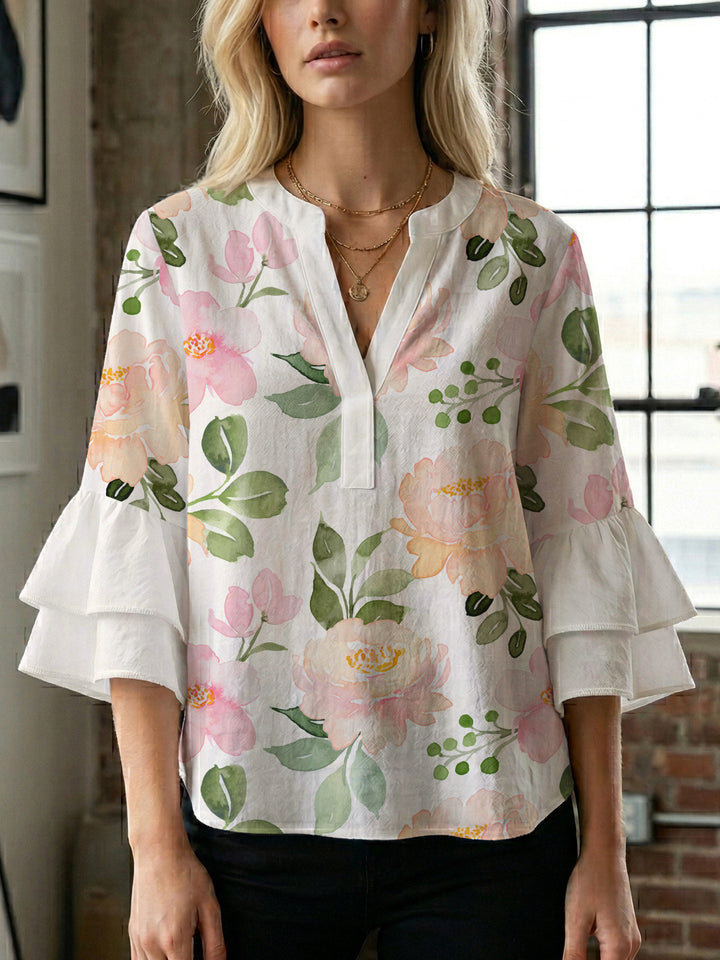 Damer elegant blusenshirt med voluminösa ryschärmar och grafisk blommönster Mirla-Eva Jonsson