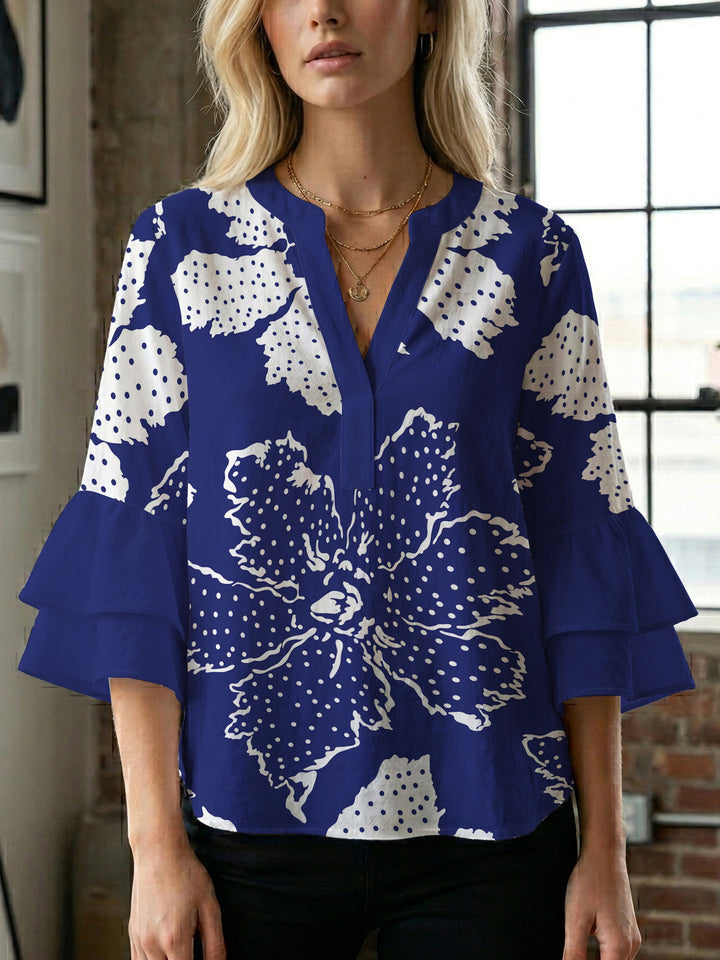 Damer elegant blusenshirt med voluminösa ryschärmar och grafisk blommönster Mirla-Eva Jonsson