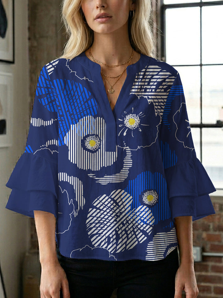 Damer elegant blusenshirt med voluminösa ryschärmar och grafisk blommönster Mirla-Eva Jonsson