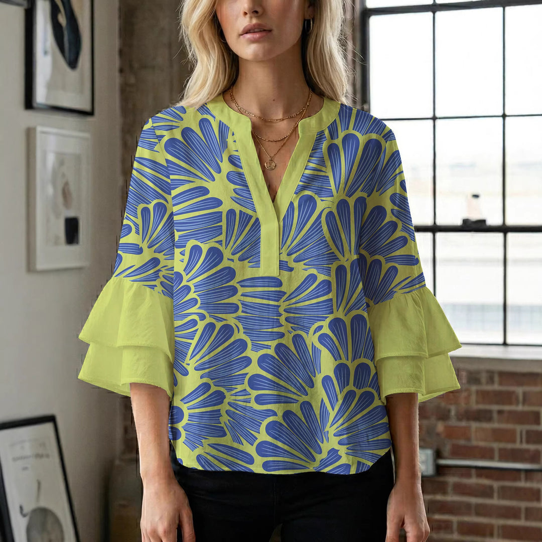 Damer elegant blusenshirt med voluminösa ryschärmar och grafisk blommönster Mirla-Eva Jonsson