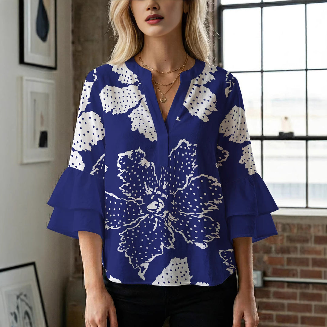 Damer elegant blusenshirt med voluminösa ryschärmar och grafisk blommönster Mirla-Eva Jonsson