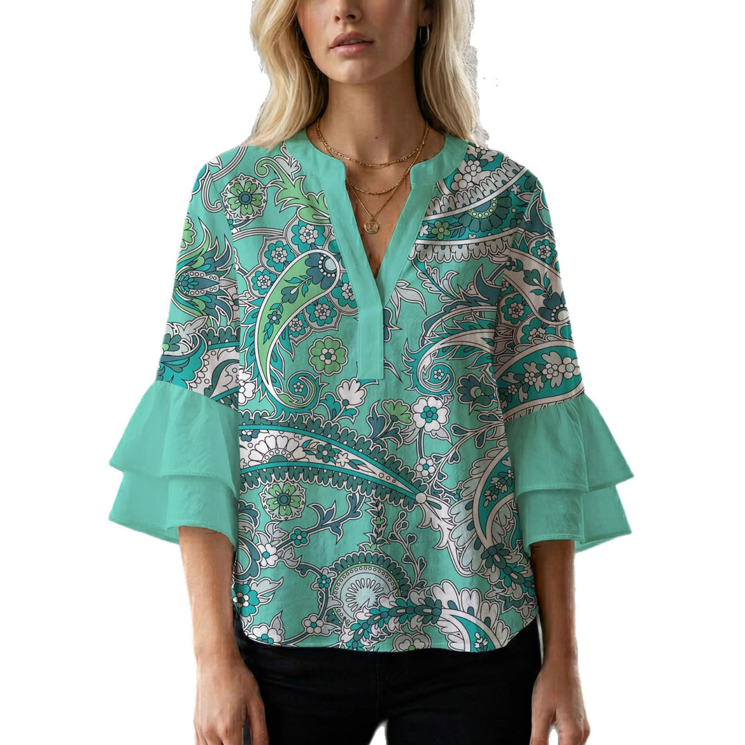 Damer elegant blusenshirt med voluminösa ryschärmar och grafisk blommönster Mirla-Eva Jonsson