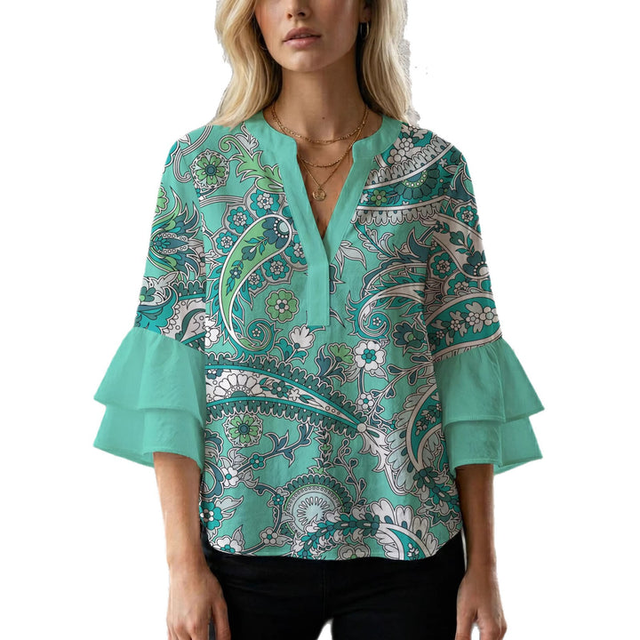 Damer elegant blusenshirt med voluminösa ryschärmar och grafisk blommönster Mirla-Eva Jonsson