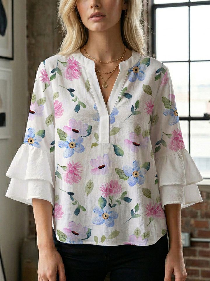 Damer elegant blusenshirt med voluminösa ryschärmar och grafisk blommönster Mirla-Eva Jonsson