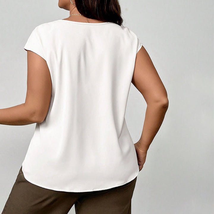 Damer elegant blusöverdel med raffinerad veckdesign och mjukt material Mirla-Eva Jonsson