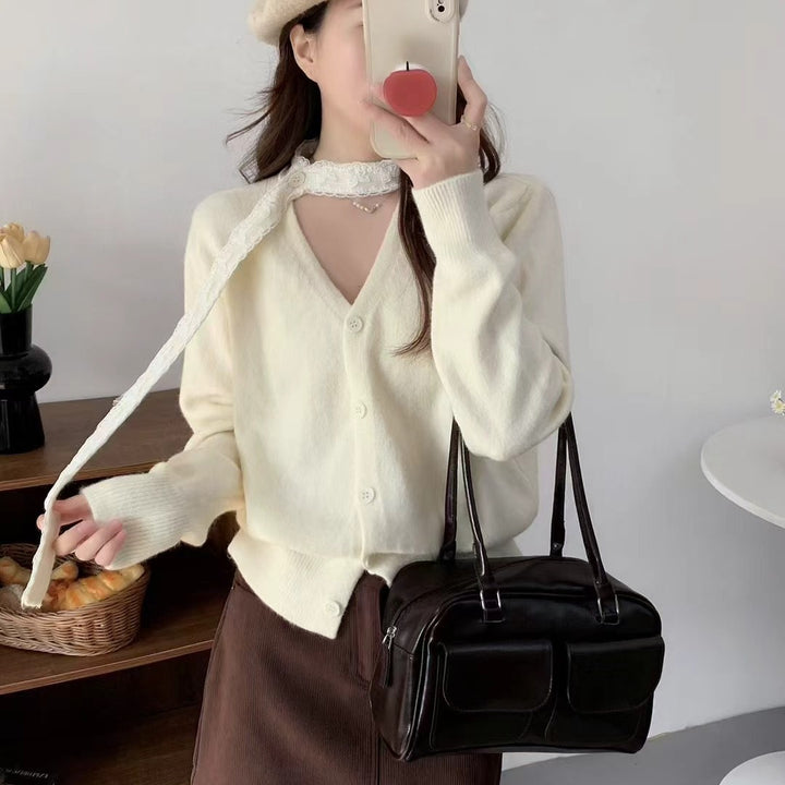 Damer elegant cardigan med V-ringning och fint knappdetalj Mirla-Eva Jonsson