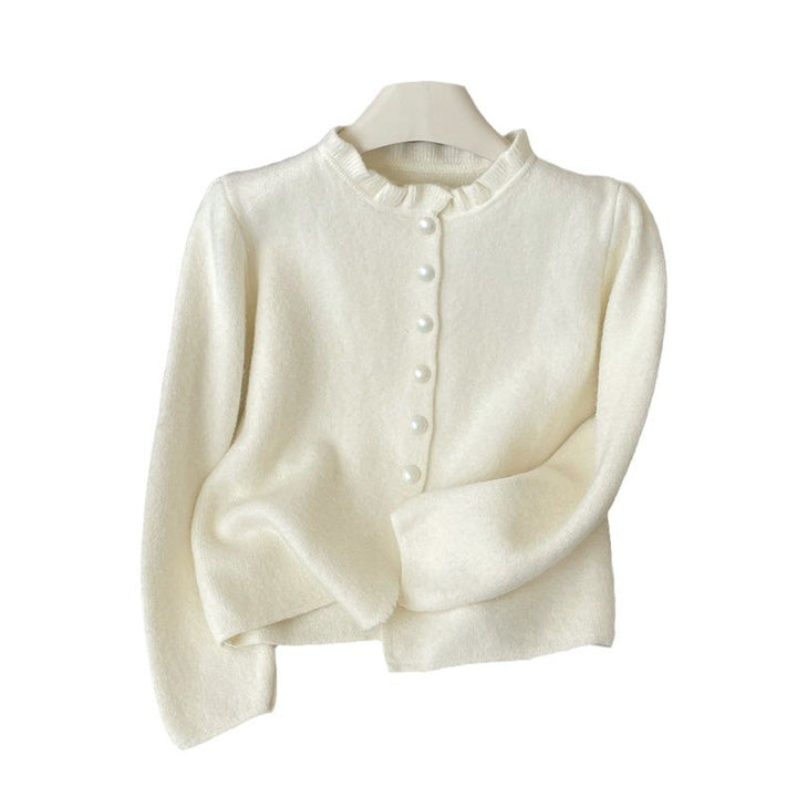 Damer elegant cardigan med feminina volanger och pärlknappar Mirla-Eva Jonsson