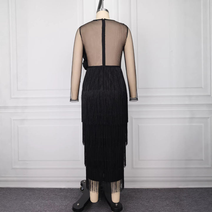 Damer elegant cocktailklänning med voluminösa volangdetaljer och fransar-Eva Jonsson
