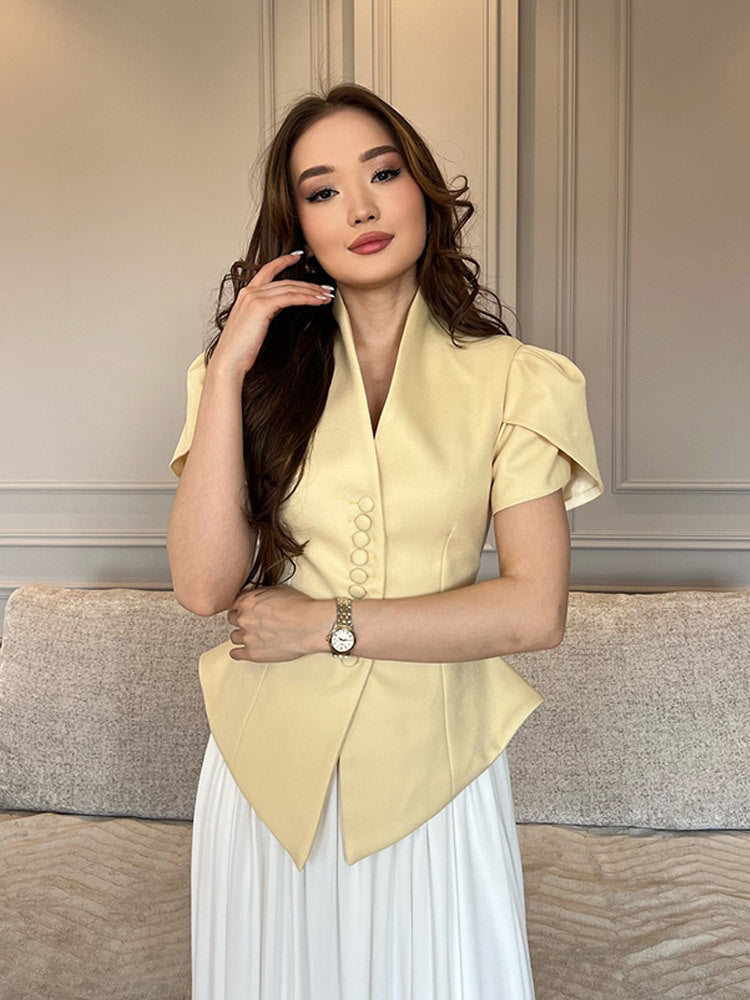 Damer elegant designerblus med puffärmar och knapppdetaljer Mirla-Eva Jonsson