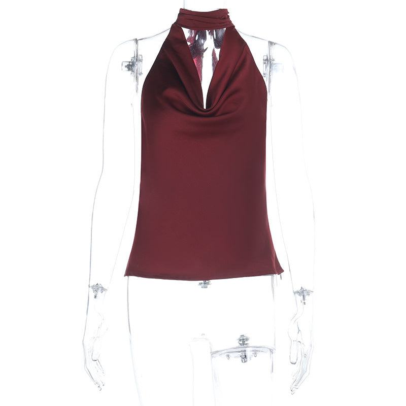 Damer elegant halterneck topp med djup V-hals och figurnära passform Mirla-Eva Jonsson